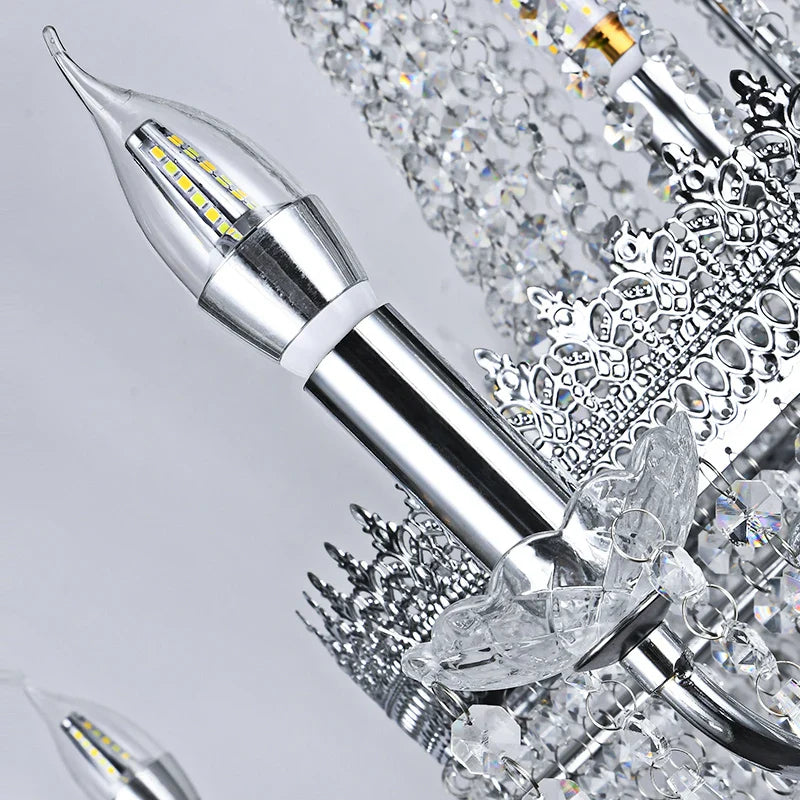 Close-up of crystal arm and candle bulb detail on Belmond chandelier