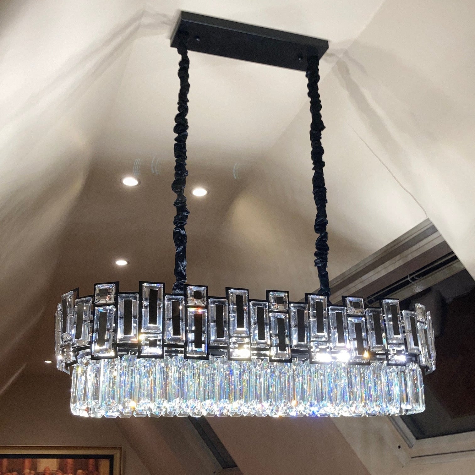 Belvedere rectangular chandelier suspended from ceiling in modern interior
