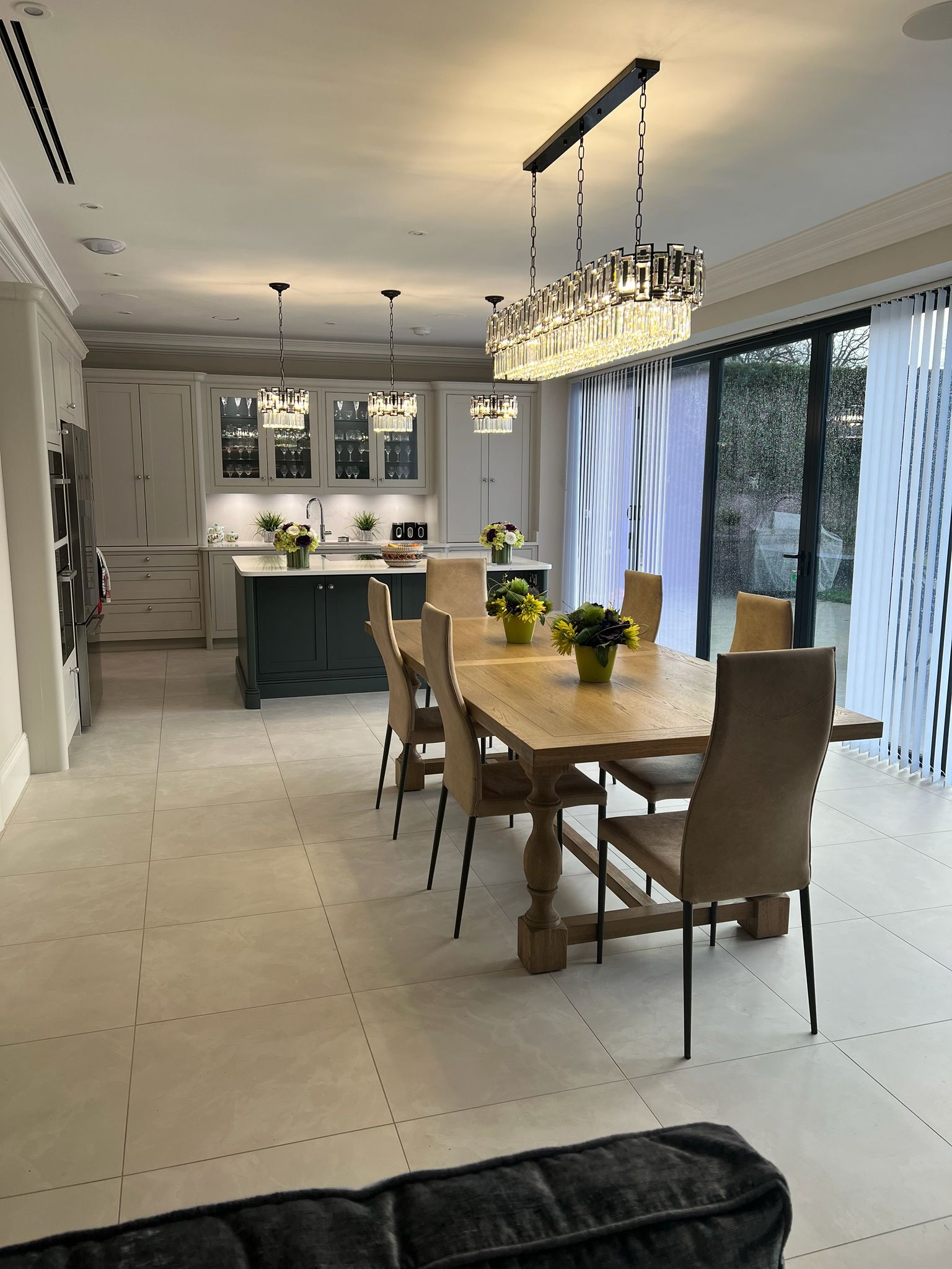 Belvedere crystal linear chandelier above kitchen island
