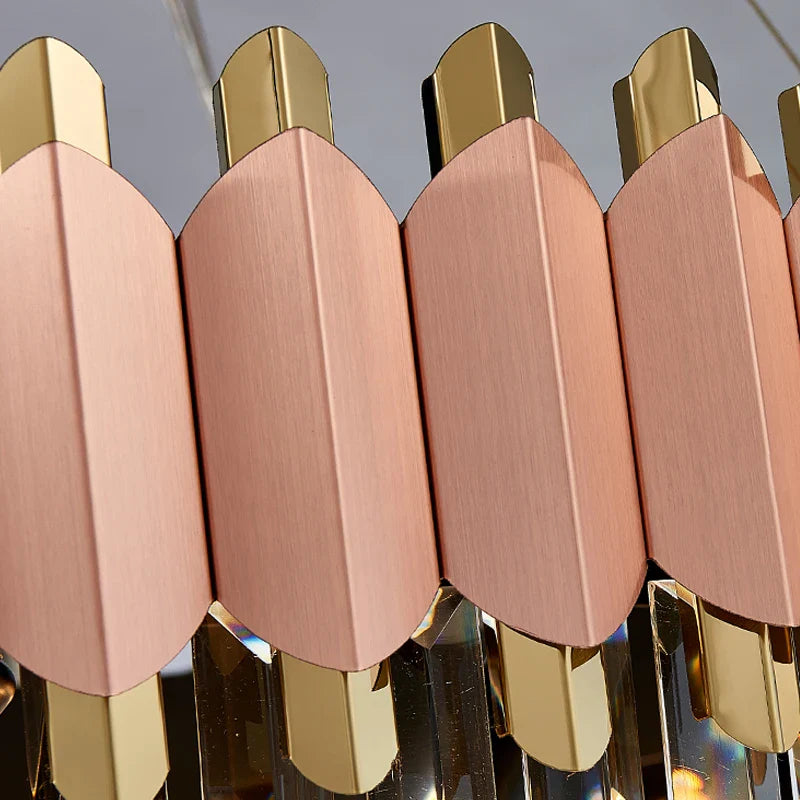 Close-up of brushed rose gold frame and diamond-cut crystal detailing on Bianca chandelier