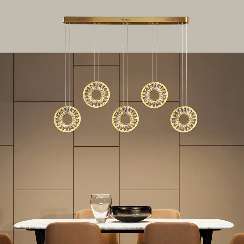 Bocelli crystal ring rectangular chandelier installed above dining table