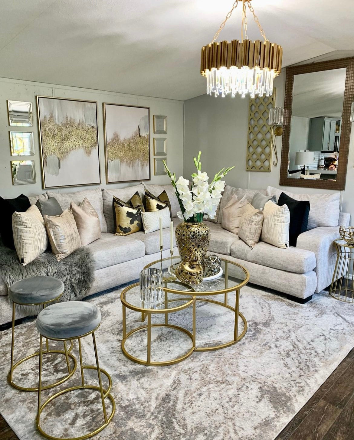 Boeotia gold circular chandelier in upscale open-plan living area