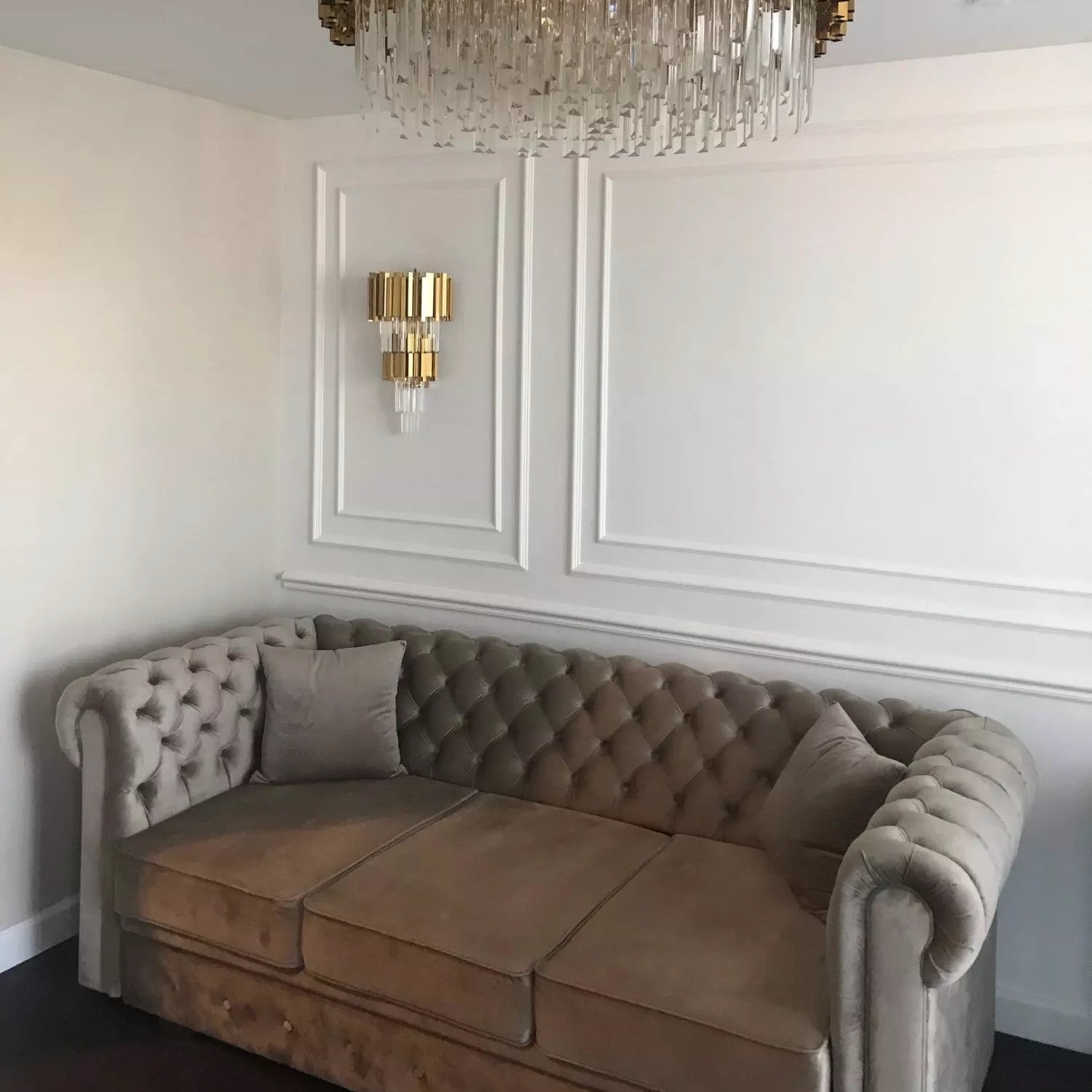 Boeotia double wall light installed above sofa in luxury interior
