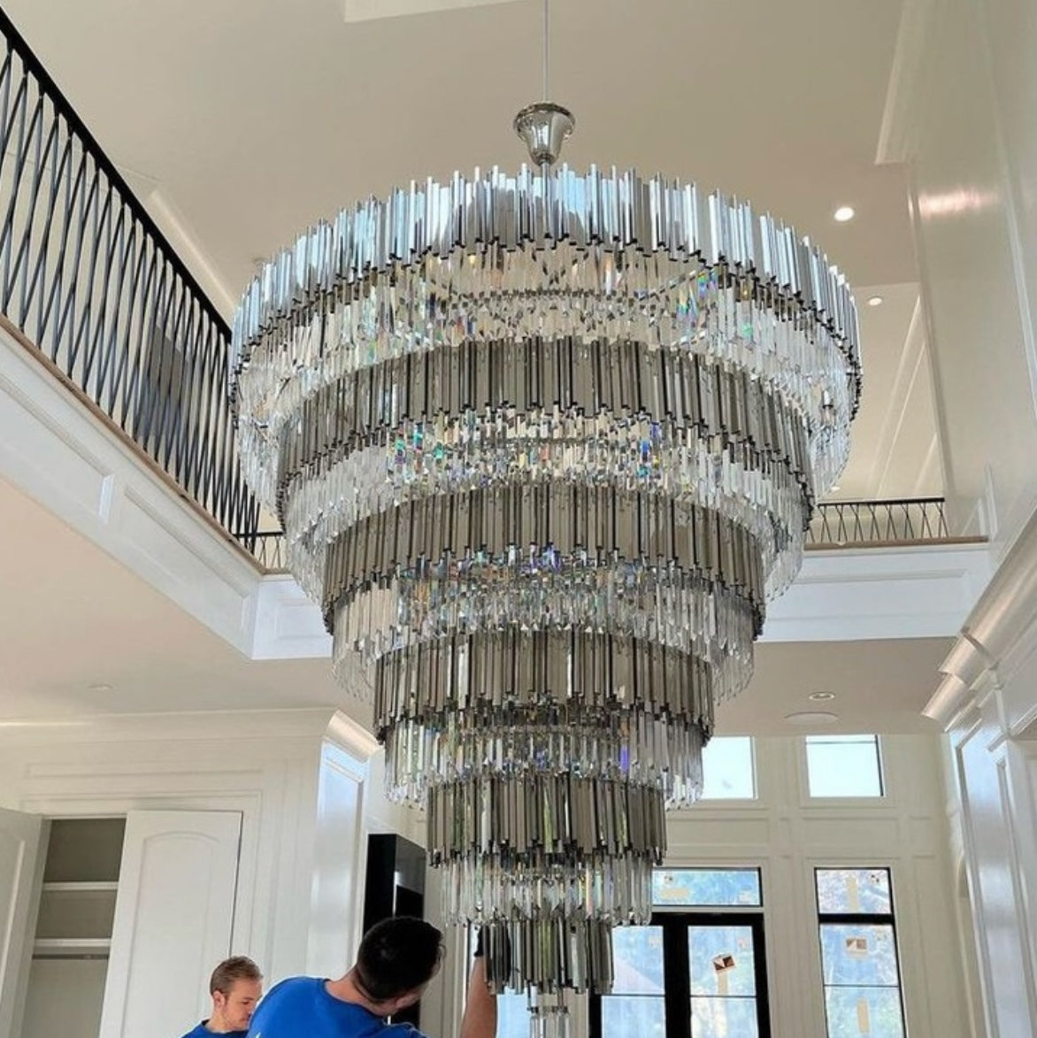 Boeotia Grandeur chandelier installed in double-height staircase foyer