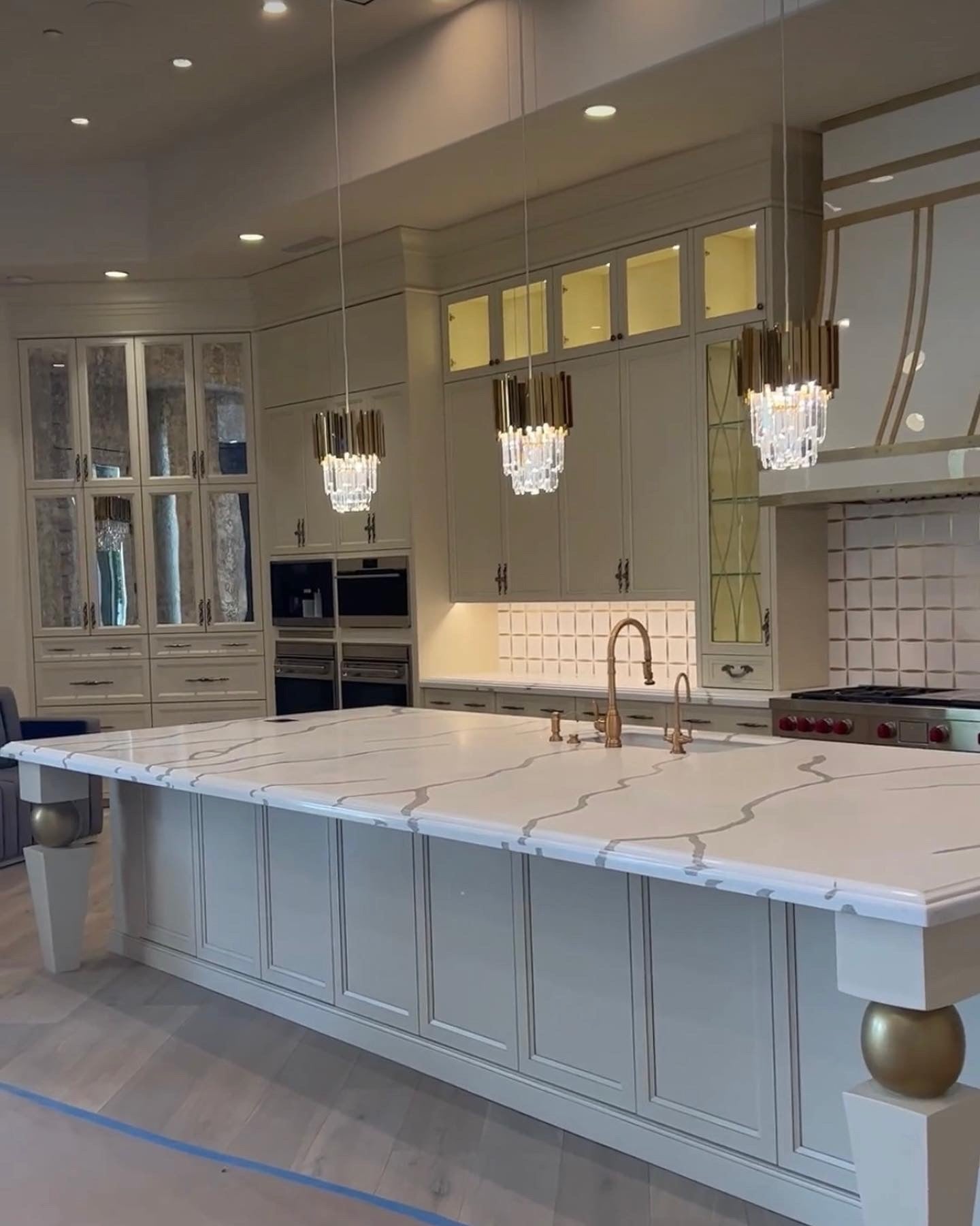 Boeotia pendant light illuminating luxury kitchen interior