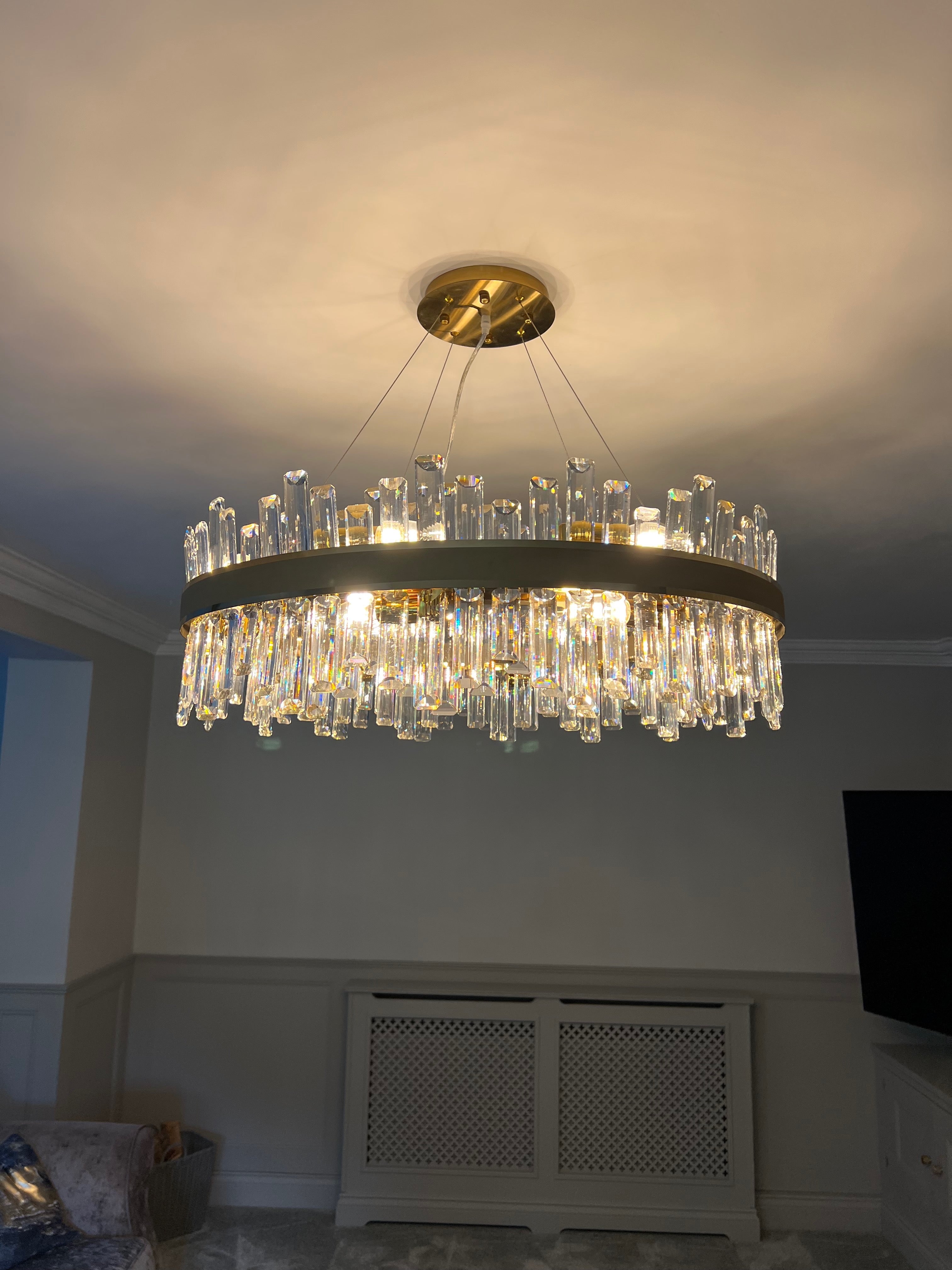 Suspended Brighouse circular chandelier featuring a crystal ring design in a luxury interior
