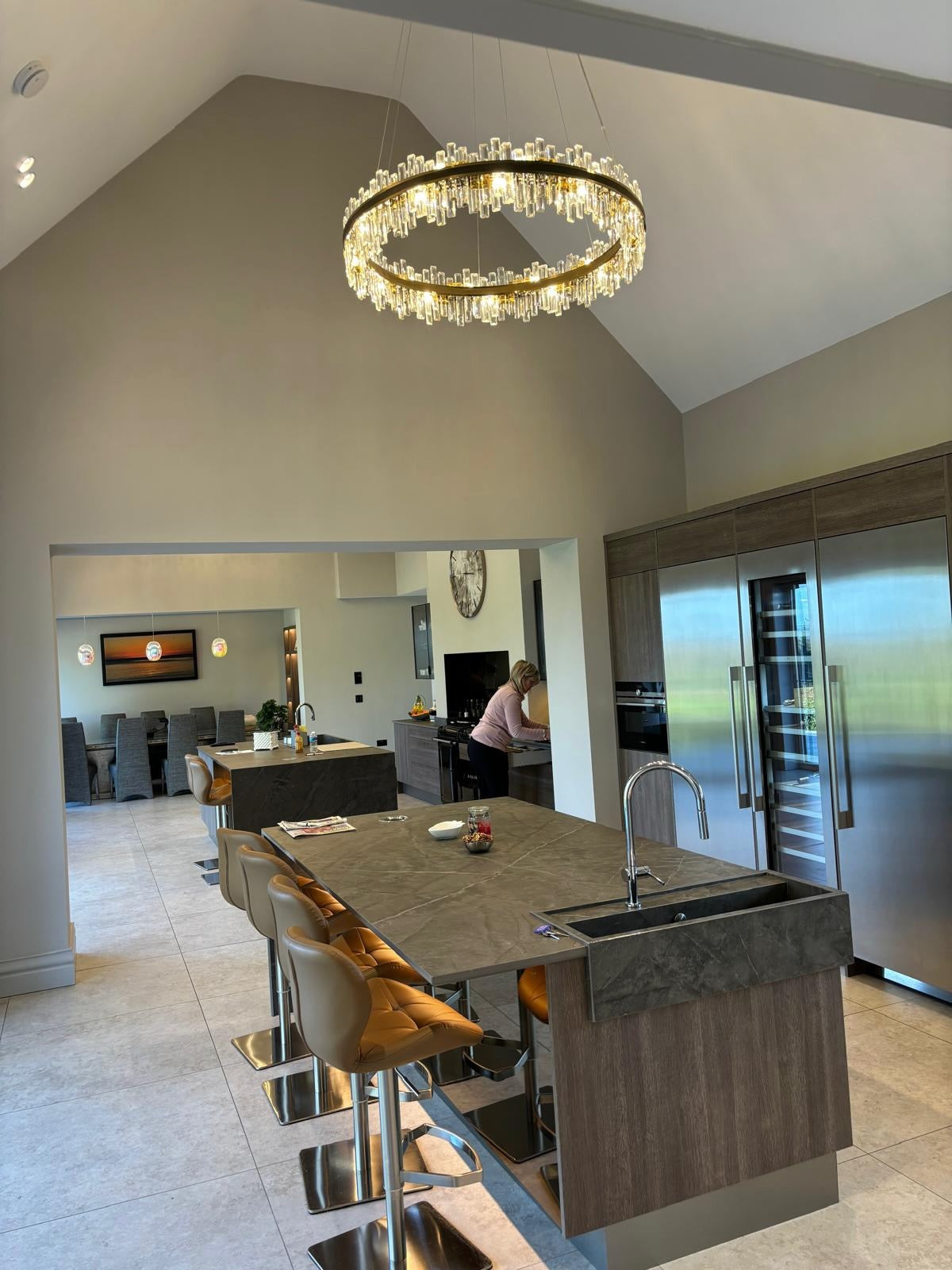 Brighouse circular chandelier in an open-plan kitchen with vaulted ceiling and crystal accents
