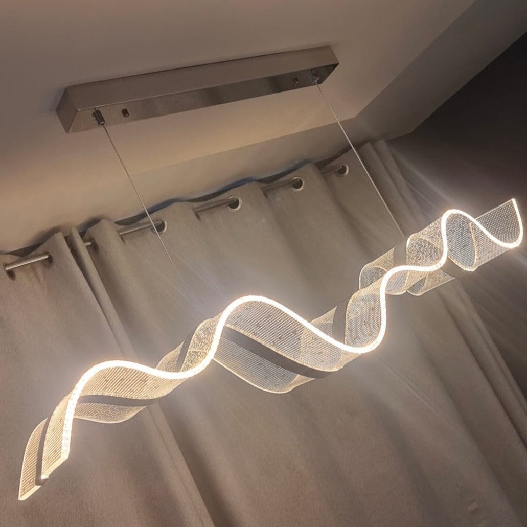 Close-up of wave-shaped light form with warm illumination