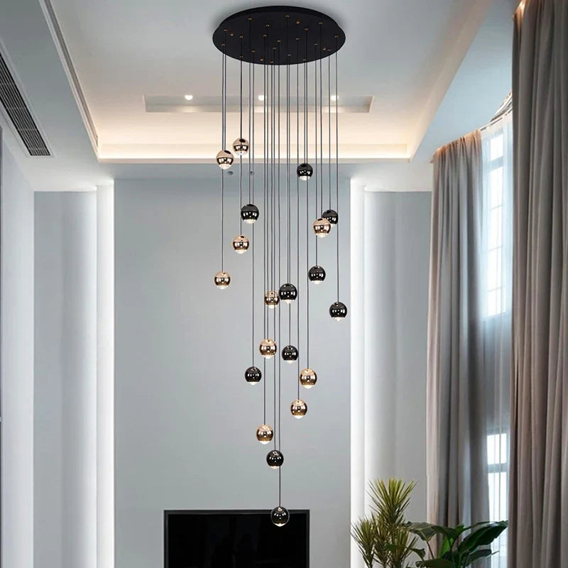 Modern cascading sphere chandelier in luxury stairwell
