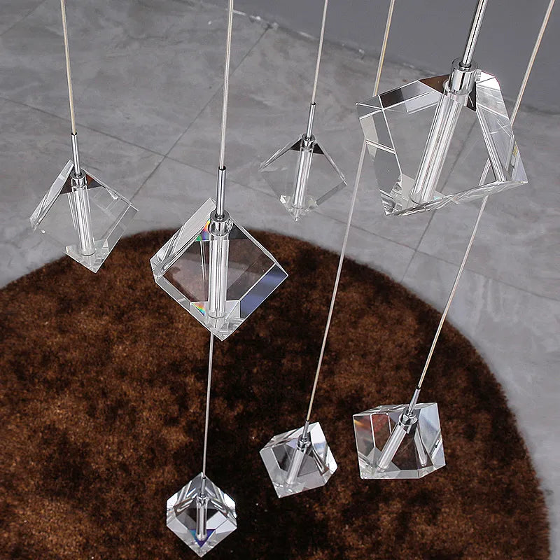 installation detail of suspended wires and cube crystals on crenshaw staircase chandelier
