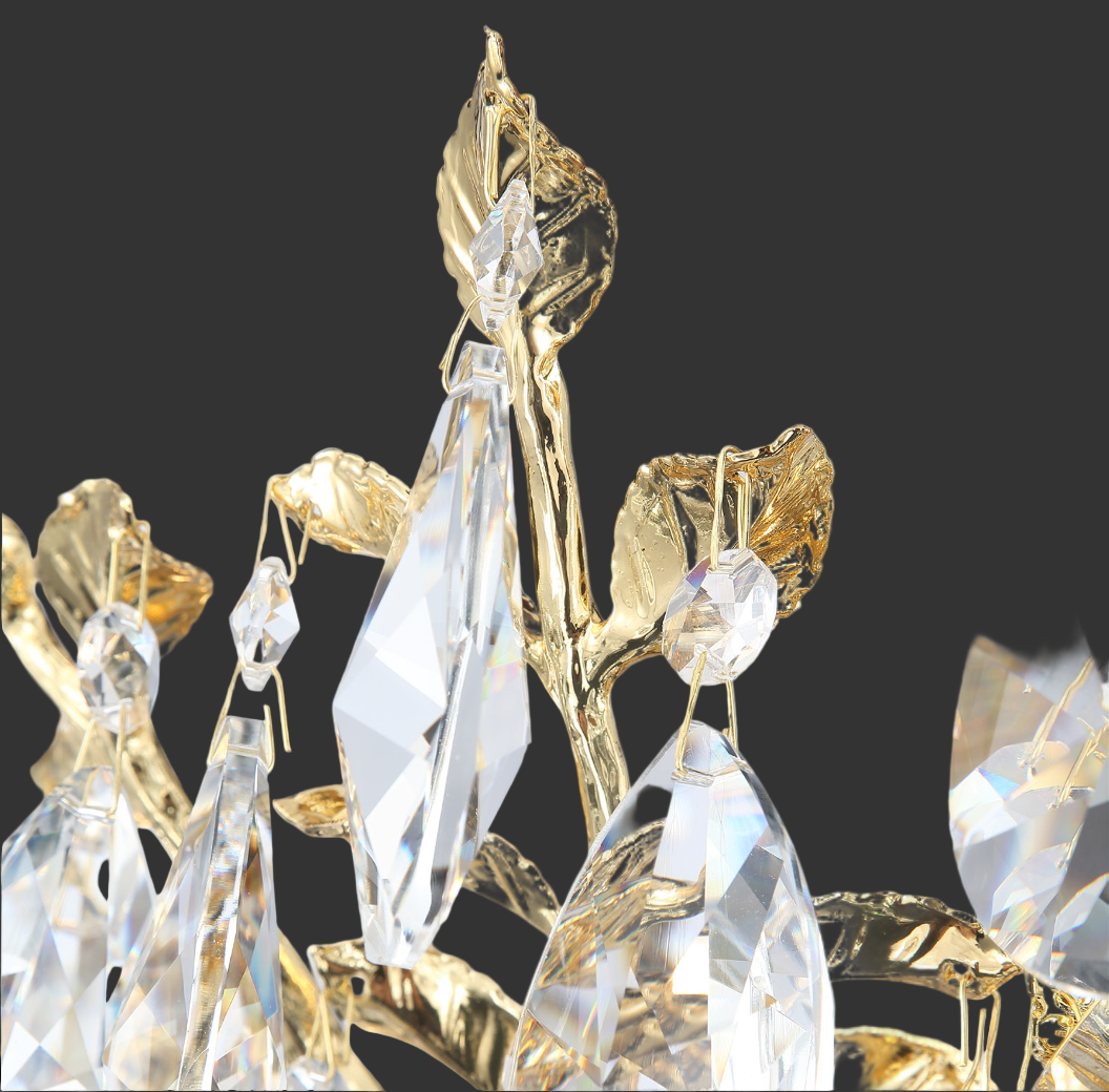 Close-up of Dewdrop circular chandelier showing faceted crystal drops intertwined with sculpted leaf detailing