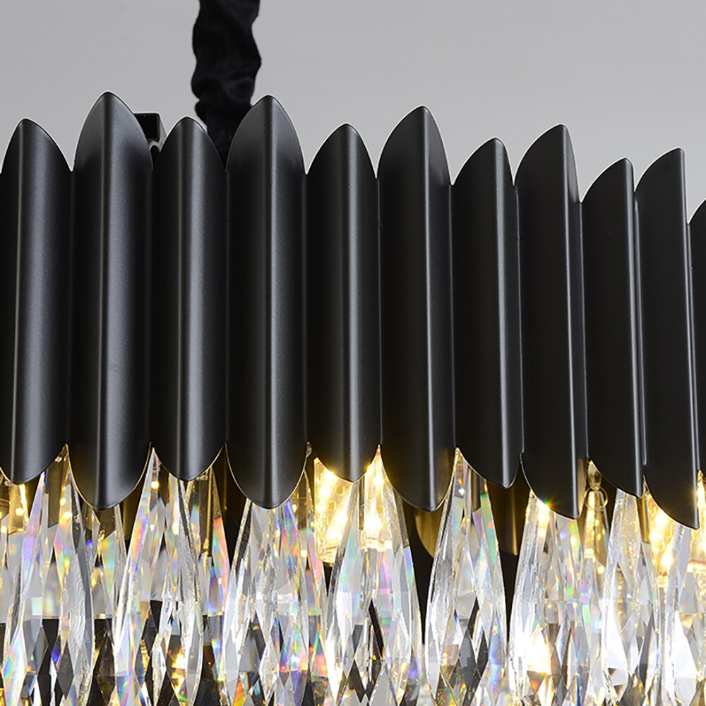 Detailed view of black vertical fins paired with diamond cut teardrop crystals