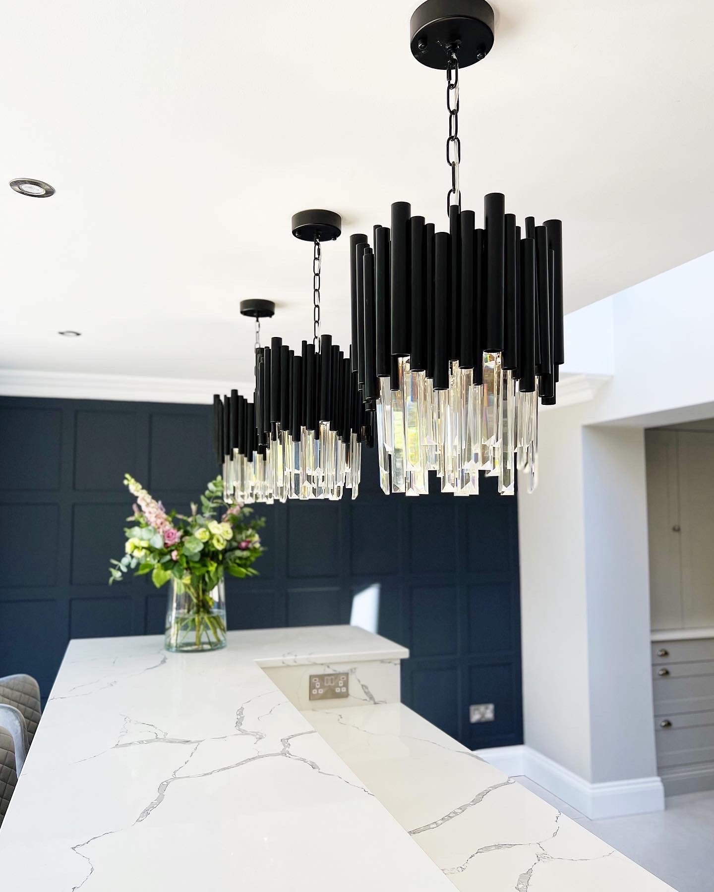 Gotham pendant lighting over a modern kitchen island