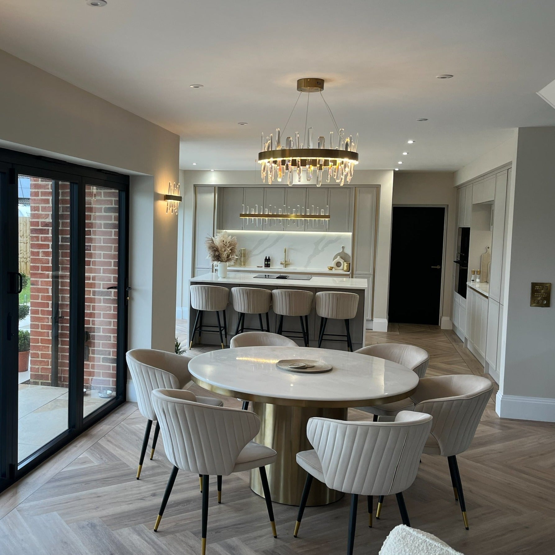 Grantchester Circular Chandelier creating a refined centrepiece in a luxury dining room