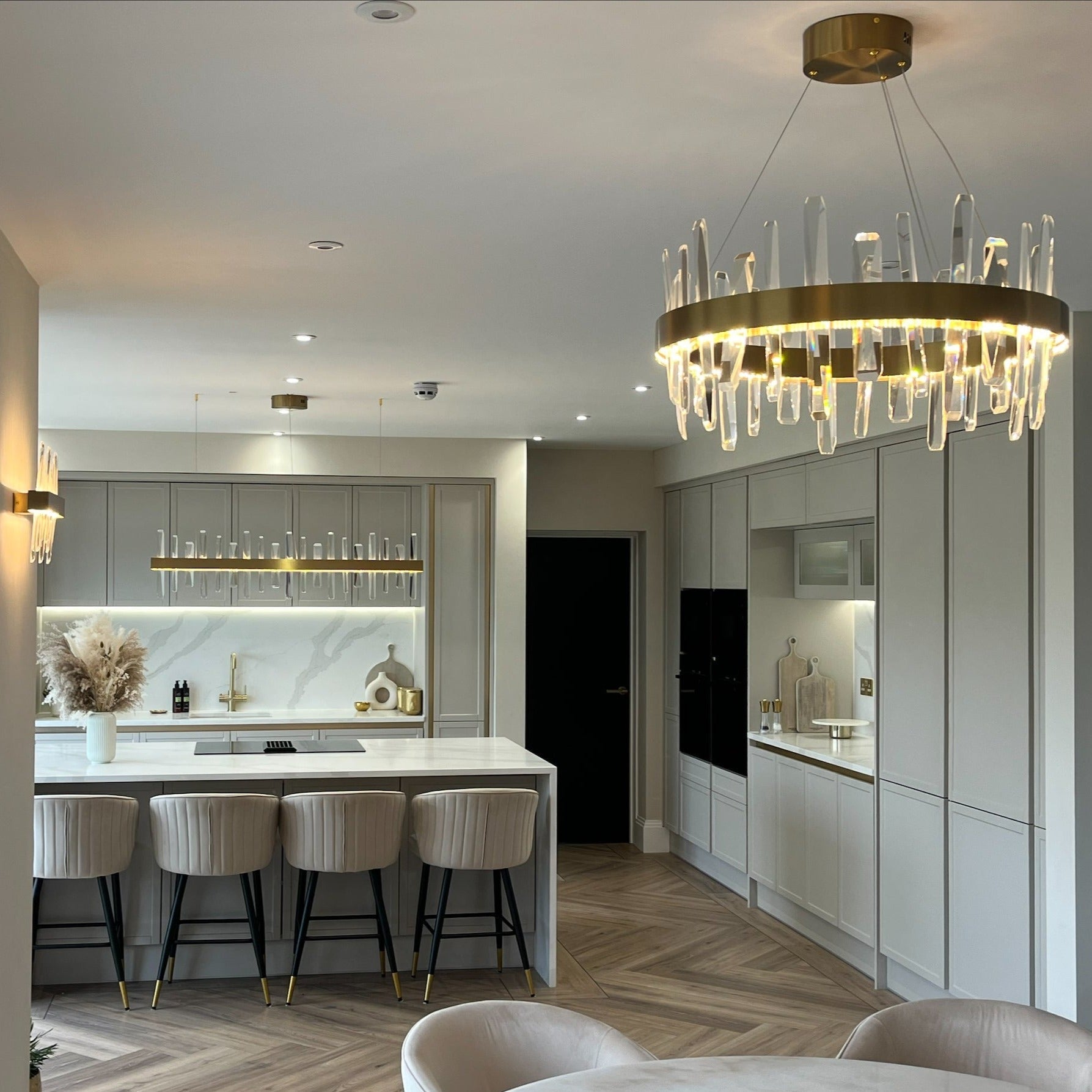 Grantchester Circular Chandelier installed above a modern kitchen and dining space