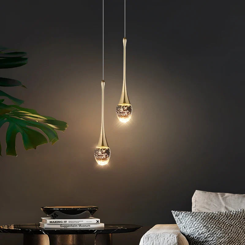 Single Henley Pendant Staircase Chandelier casting a warm ambient glow against a dark interior