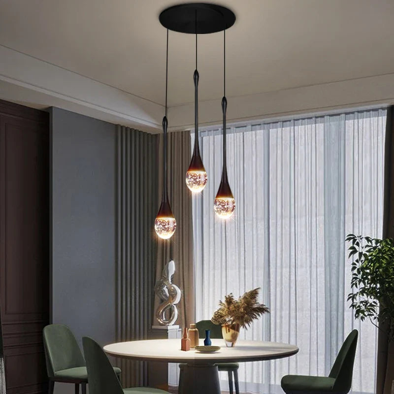 Henley Pendant Staircase Chandelier with illuminated bubble glass suspended above a modern dining space