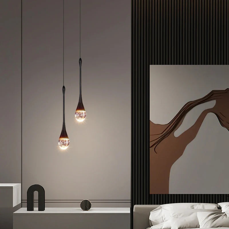 Dual Henley Pendant Staircase Chandeliers creating soft ambient lighting in a refined interior