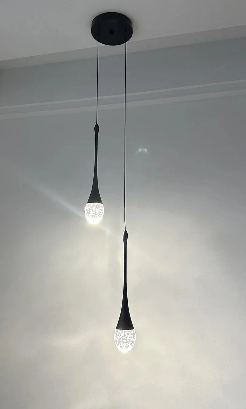 Henley Pendant Staircase Chandelier featuring a slender suspension and glowing bubble glass tip
