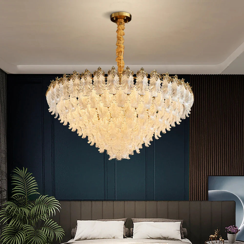 Julio Circular Chandelier suspended above a refined bedroom interior with cascading feather crystal detailing