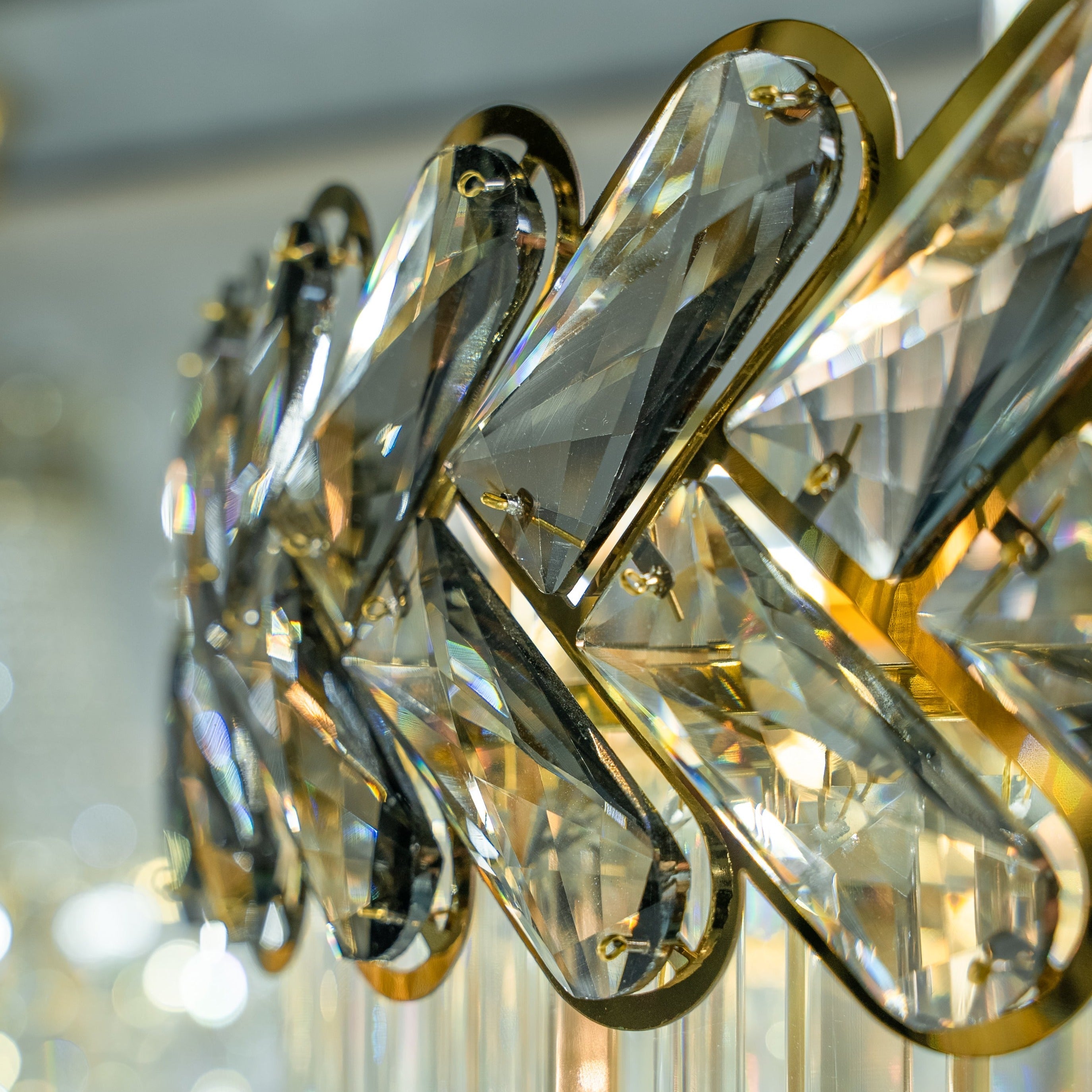 Close-up of illuminated crystal column within spiral staircase chandelier