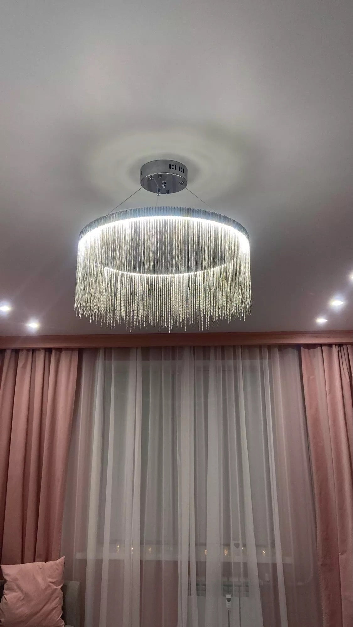 Luxury circular chandelier with cascading chains in UAE interior