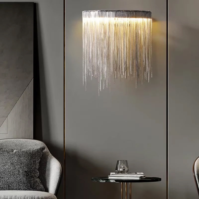Luxury wall light with cascading chains in Dubai living room