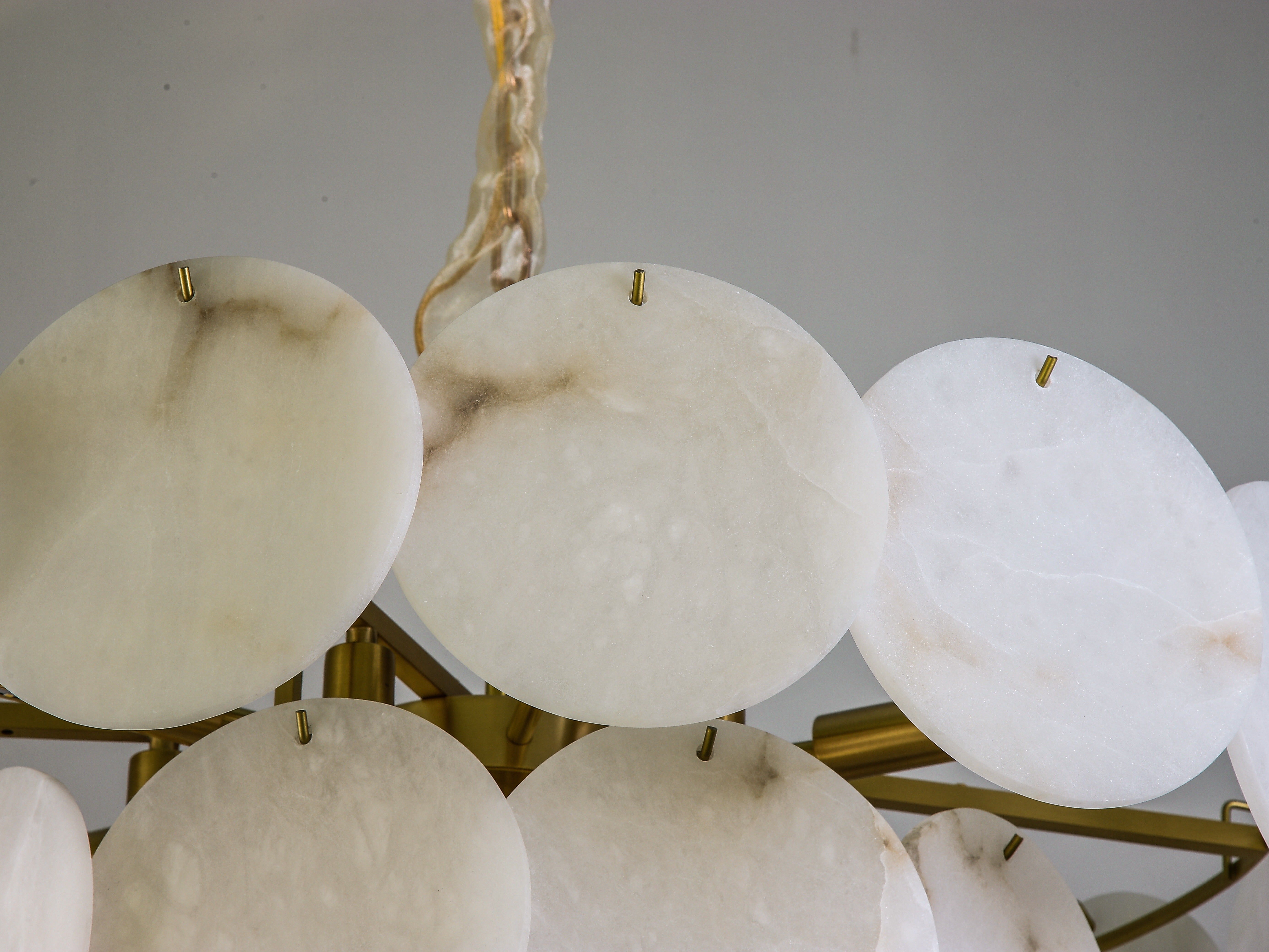 Luxury marble circular chandelier II illuminated in UAE villa