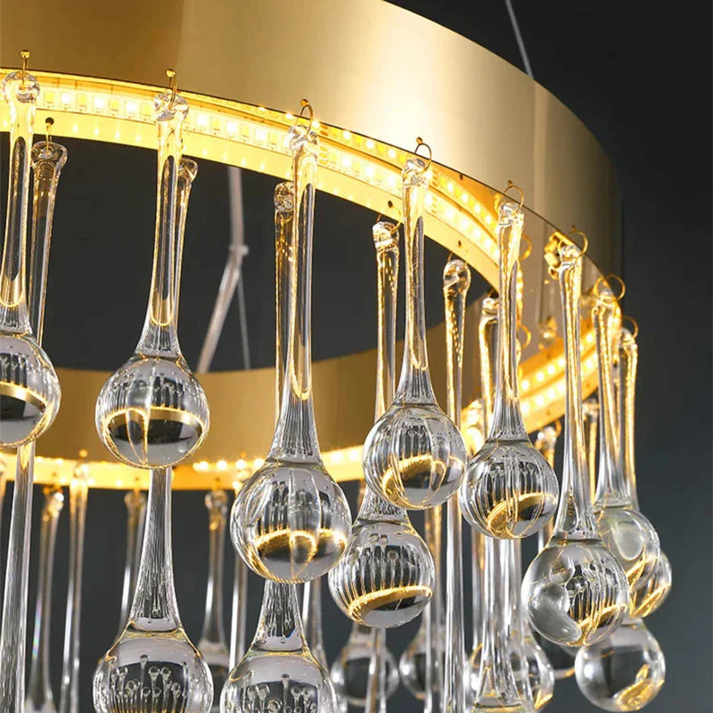 Close-up of decorative crystal droplets suspended from the Mancini ring staircase chandelier