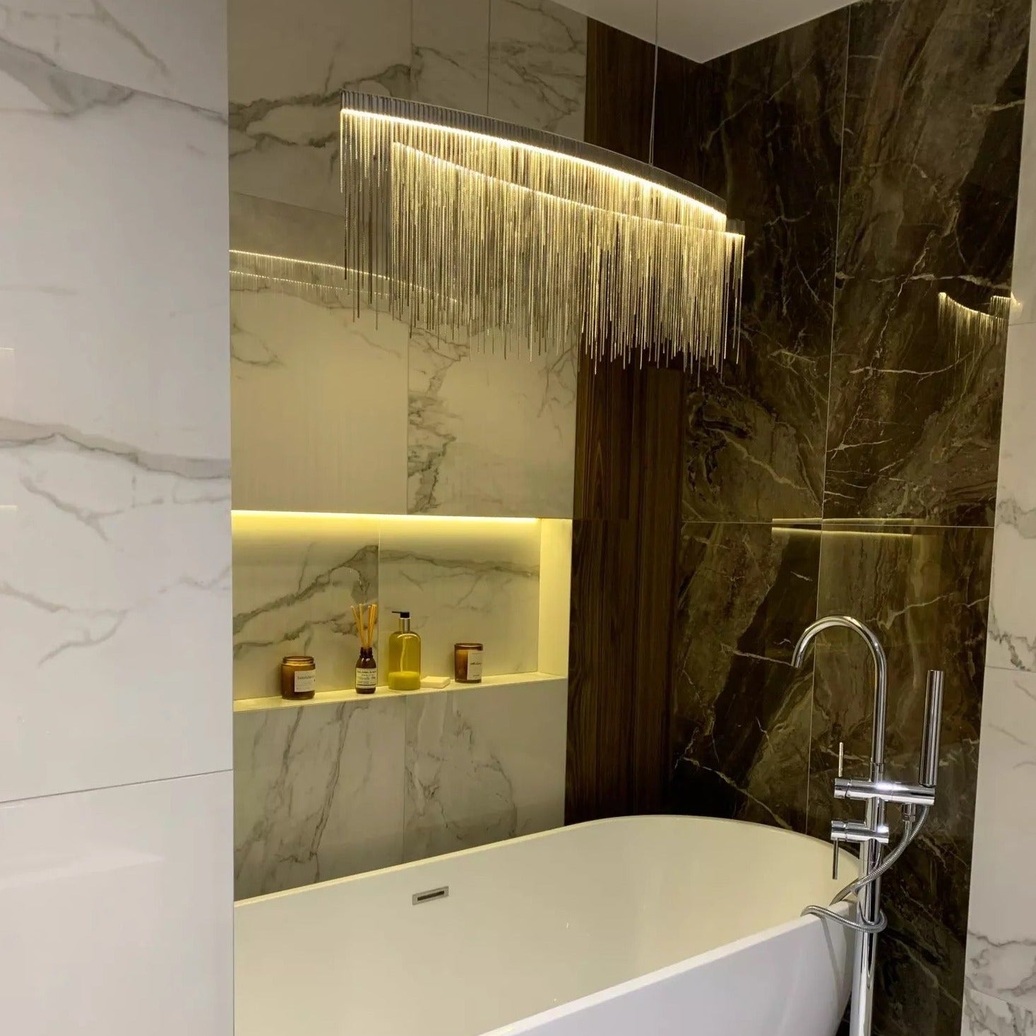 Modern arc rectangular chandelier installed in luxury Dubai interior