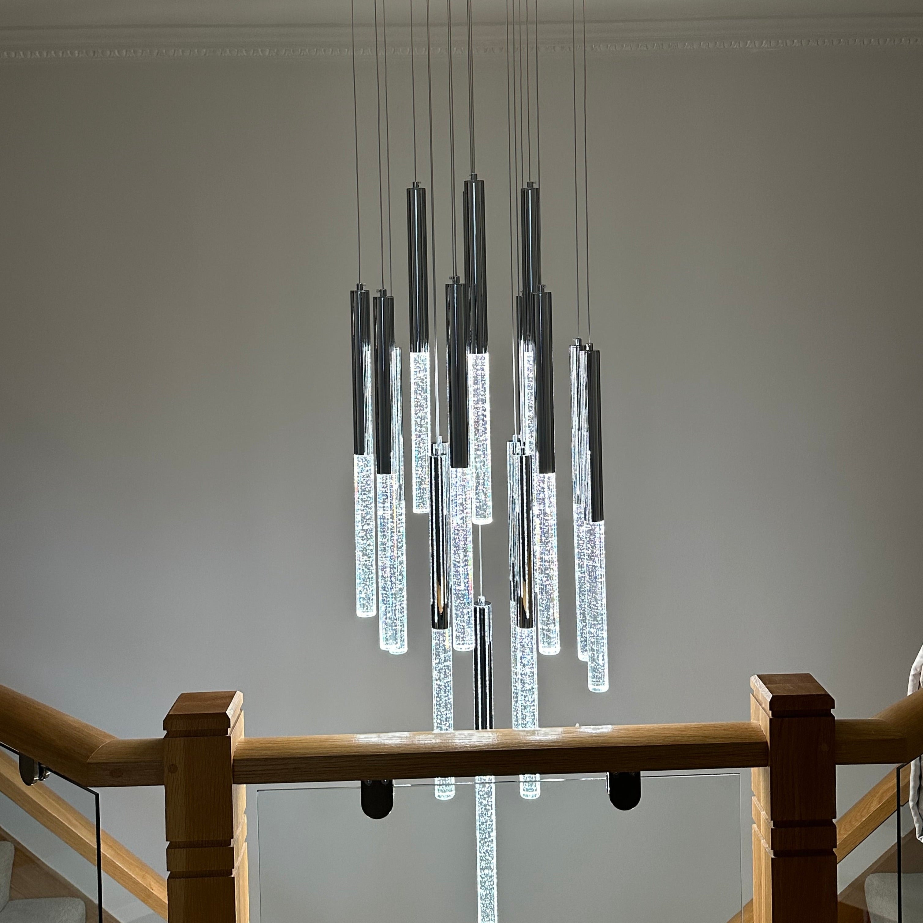Tiered crystal rod chandelier Dubai luxury staircase lighting