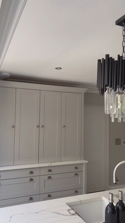 VORELLI Gotham pendant lighting displayed over a kitchen island