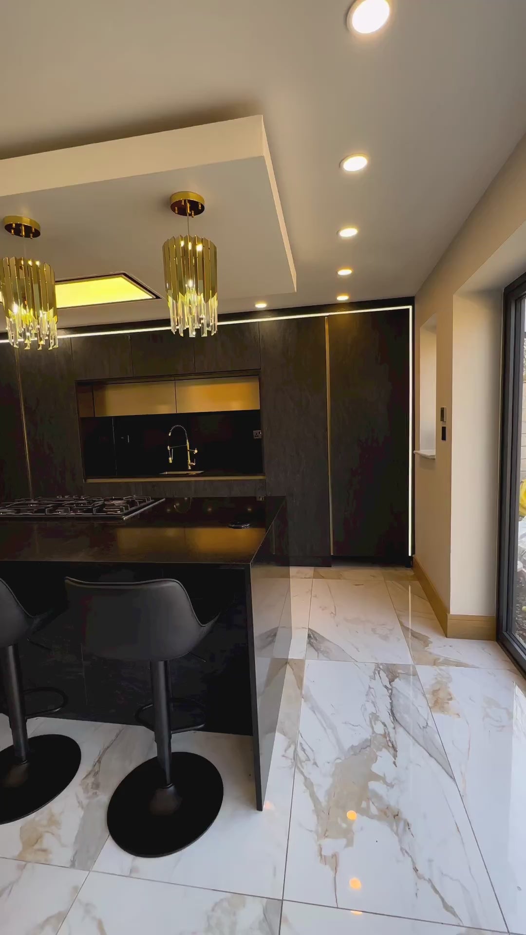  Luxury crystal pendant lighting above modern kitchen island