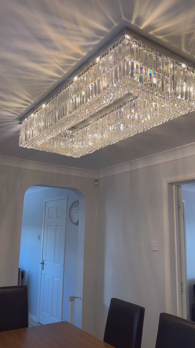 Rectangular crystal ceiling light featuring diamond cut faceted crystals creating refined ambient lighting