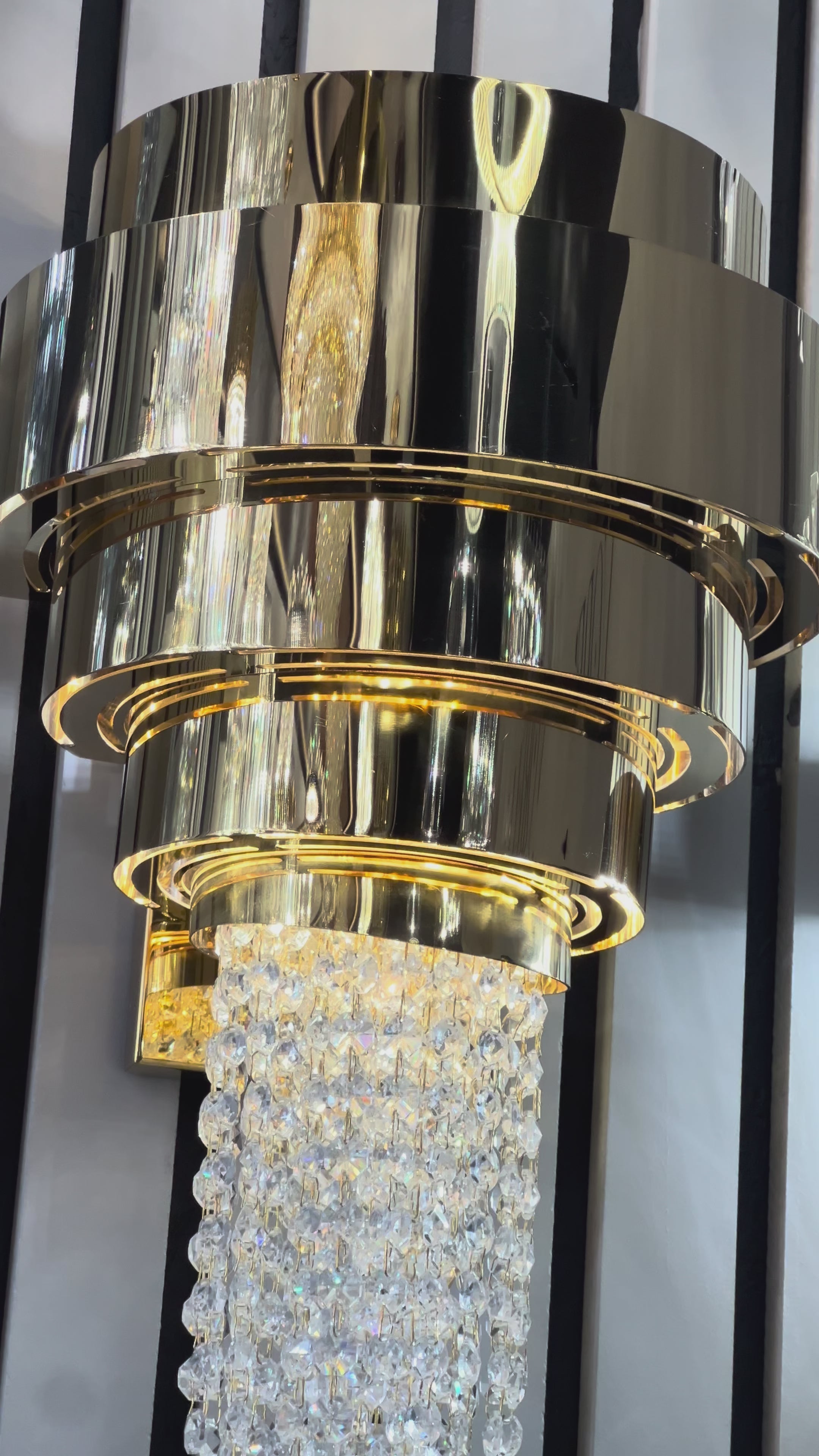 Champs Élysées inspired wall light casting a warm ambient glow in a high end interior setting