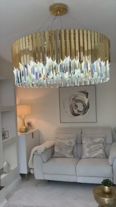 VORELLI Manhattan circular crystal chandelier suspended in a refined contemporary interior setting