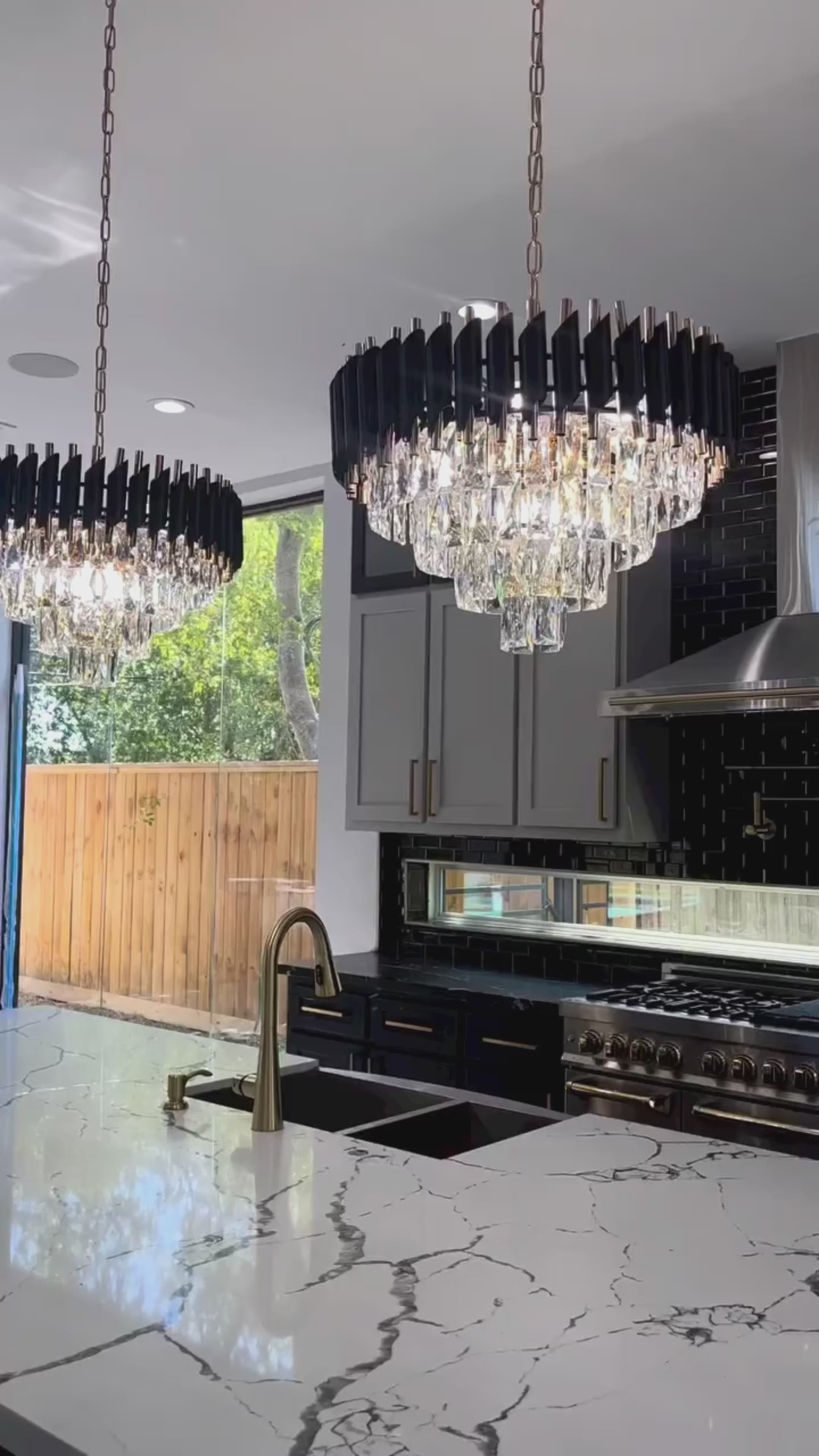 Single VORELLI Milltimber Pendant Light hanging in a contemporary interior with cascading crystal drops and cylinder tubing