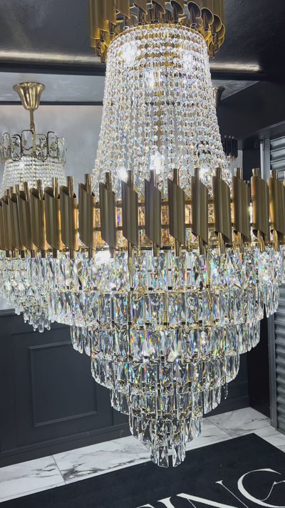 Illuminated diamond-cut crystal cascade detail on the VORELLI Milltimber Grandeur staircase chandelier