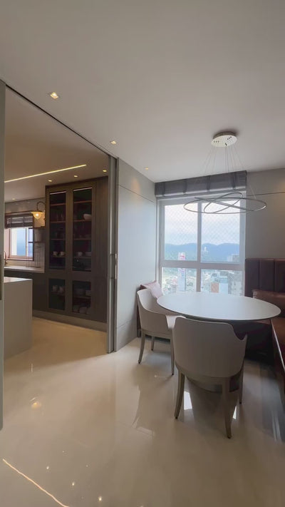 Boeotia rectangular chandelier featuring luxury crystal prisms in a refined modern interior.