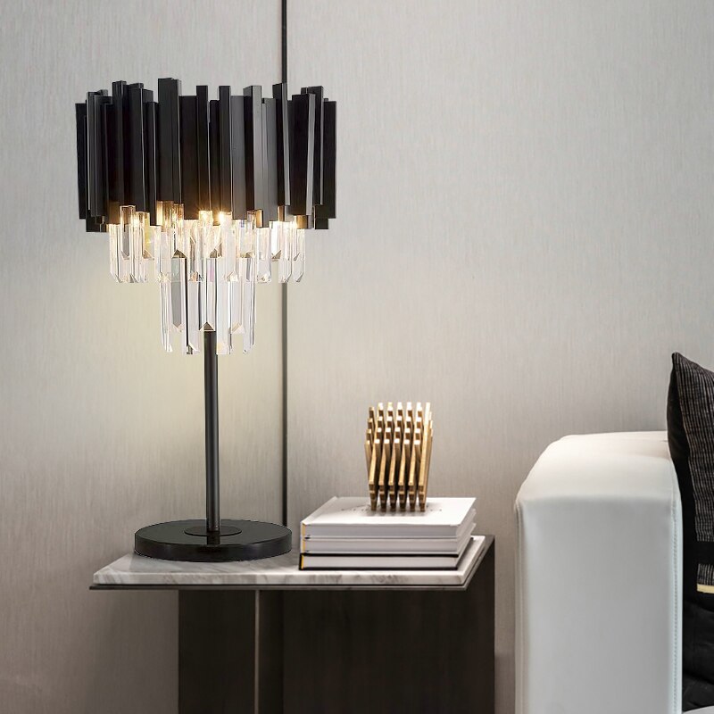 Boeotia Table Lamp displayed on a bedside cabinet, showcasing its refined black frame and crystal detailing.