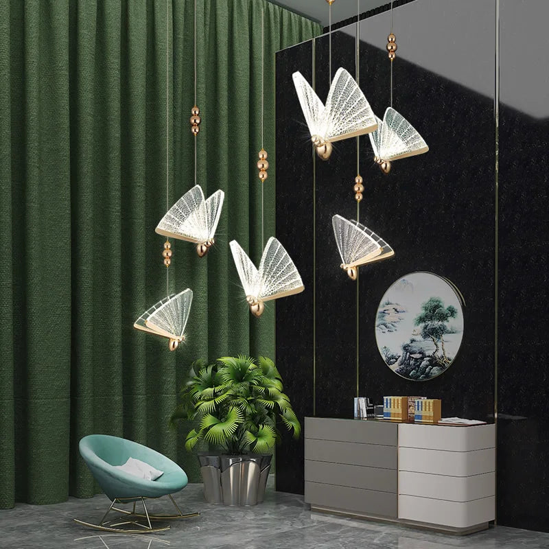 Butterfly Pendant Light featuring sculpted glass butterfly wings suspended in a playful cluster within a modern interior.