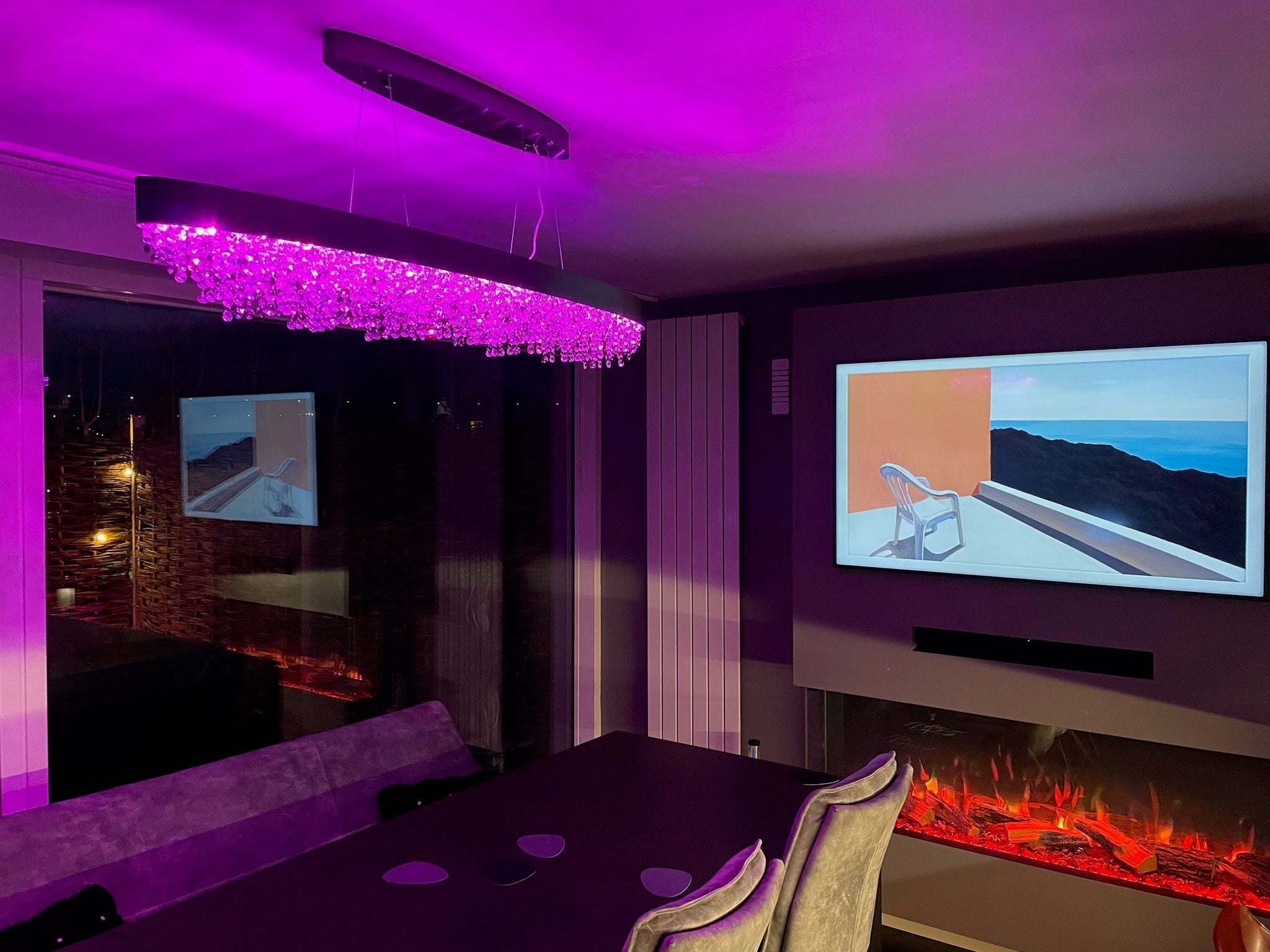 Contemporary kitchen illuminated by the VORELLI® Donatello rectangular crystal chandelier