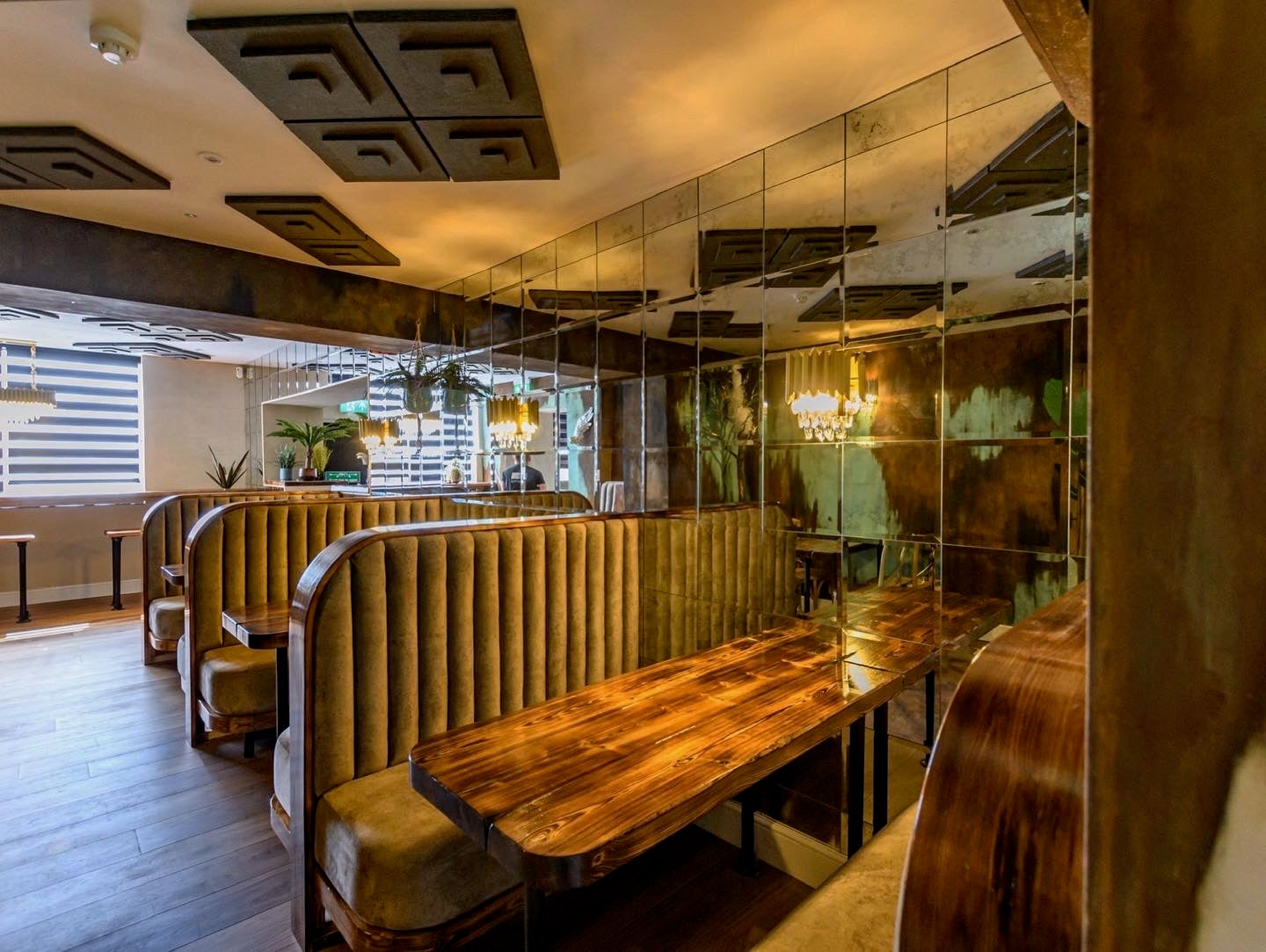 Luxury Doral wall light installed in contemporary hospitality restaurant interior