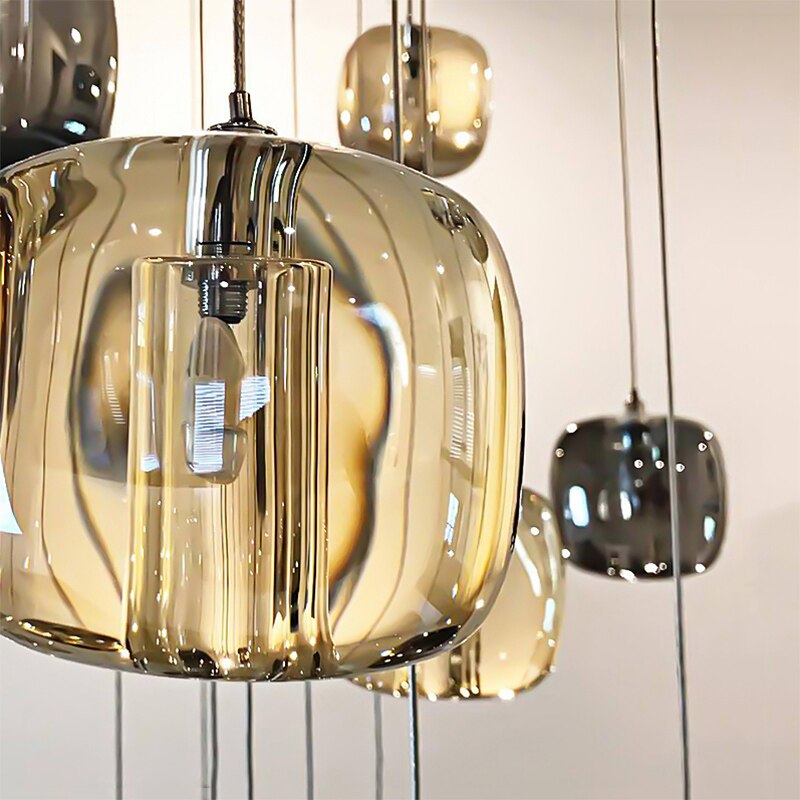 Hand-finished glass pendant detail from luxury staircase chandelier design