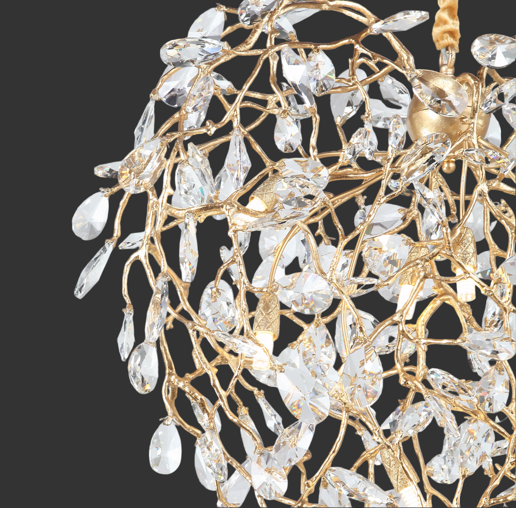 Close-up of Entwine Heart Pendant Light showcasing entwined gold structure and diamond cut crystal detailing