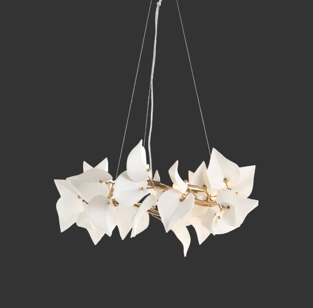 Fiorella Circular Chandelier by VORELLI® shown from a side angle highlighting the layered floral silhouette and soft ambient glow