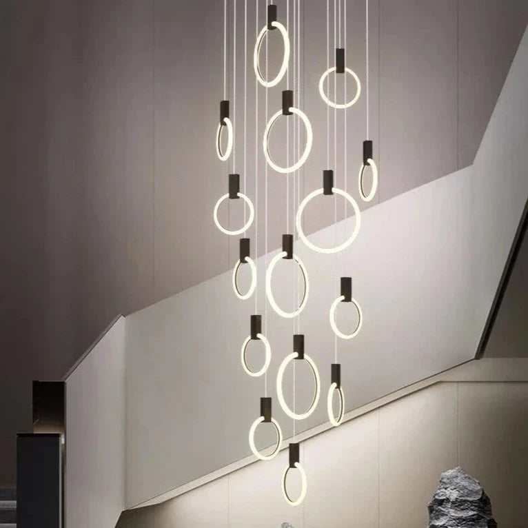 Formby LED ring chandelier in free-fall staircase configuration
