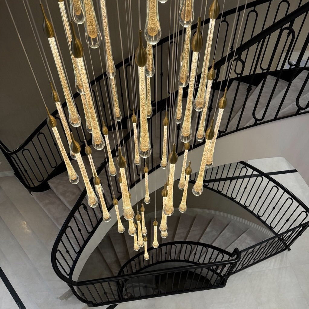 VORELLI Foshan pendant staircase chandelier cascading through luxury spiral stairwell