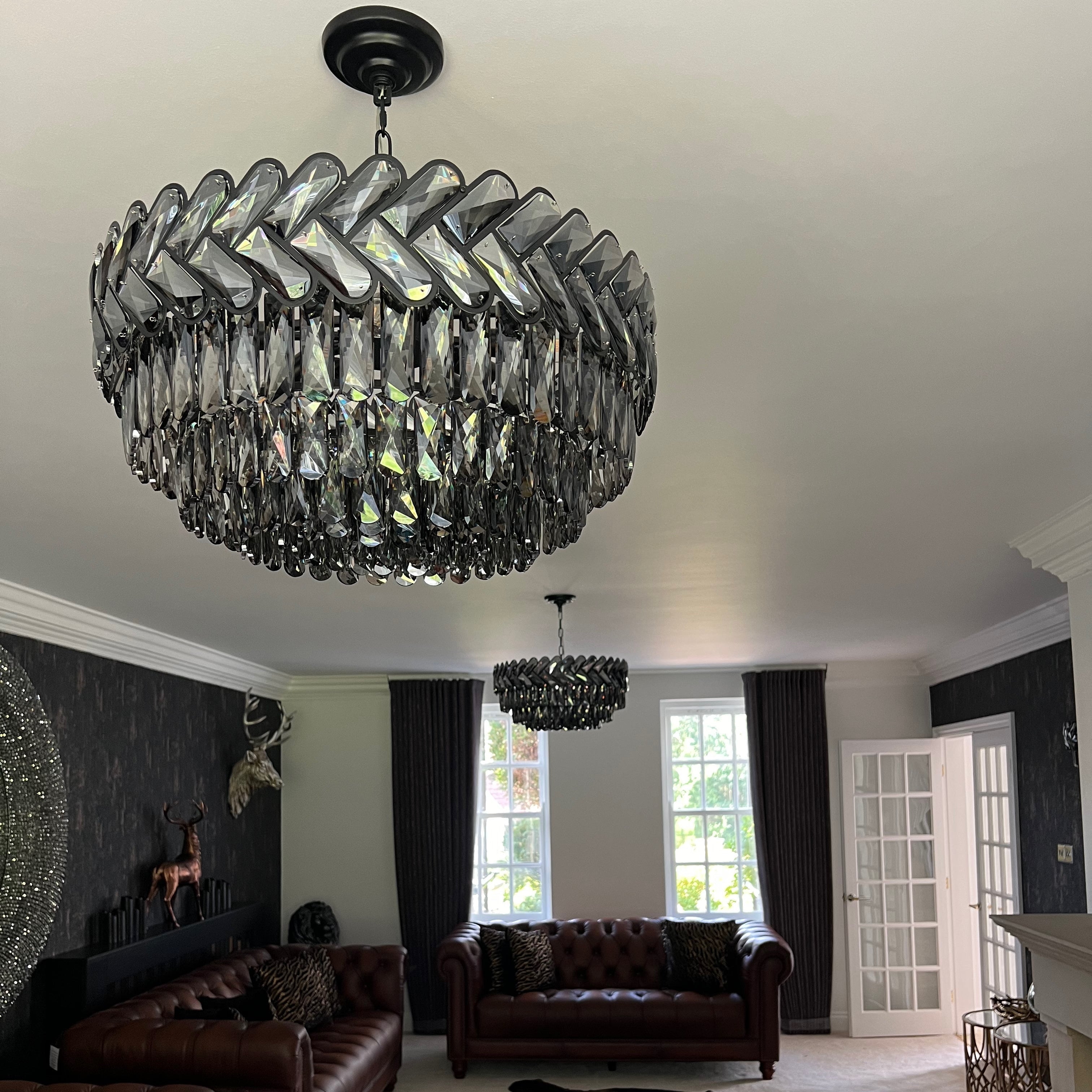 VORELLI Knightsbridge circular chandelier with chevron crystal design in luxury living room