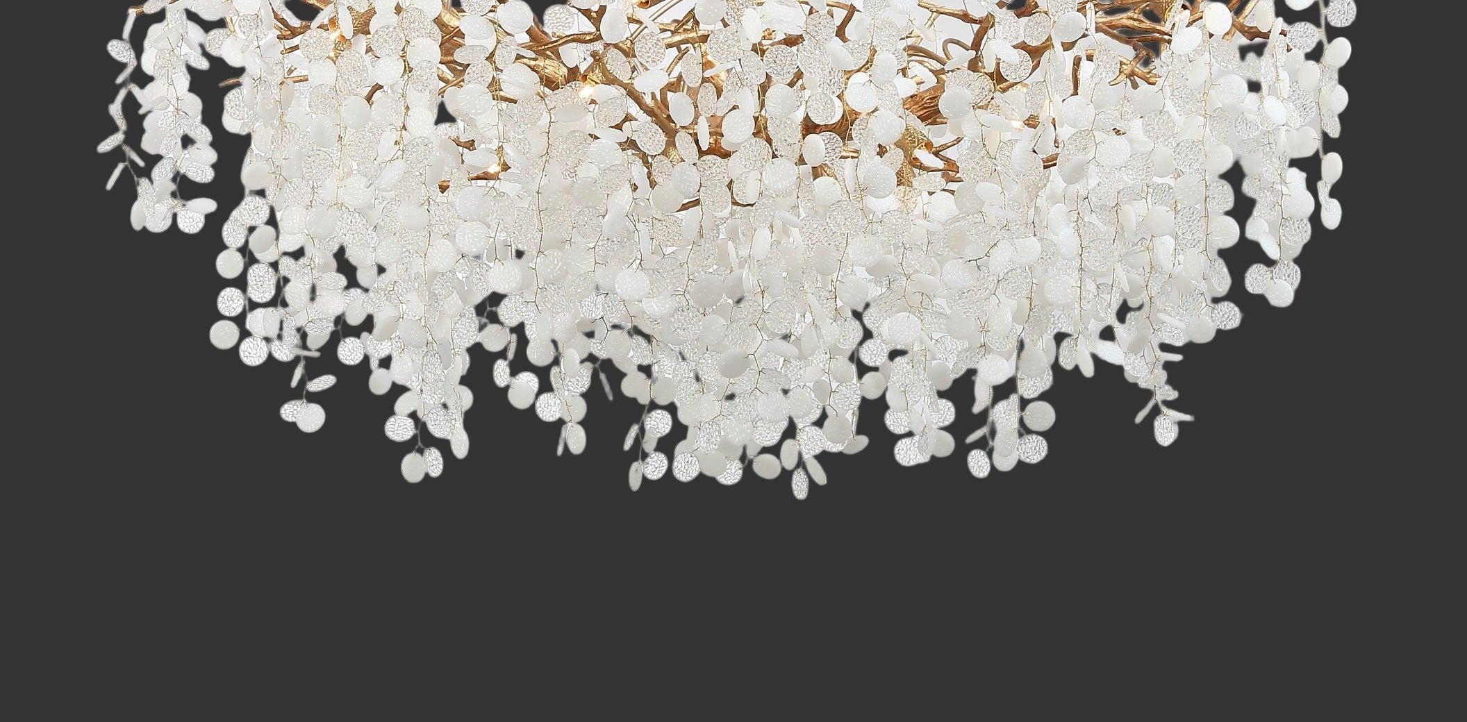 Close-up of Lunaria circular chandelier showing layered glass discs and organic form